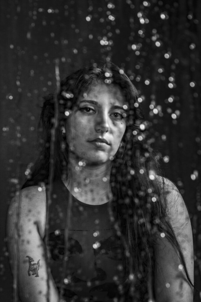 Girl with an overlay of droplets in black and white